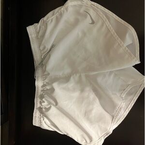 White athletic shorts with built in underwear.